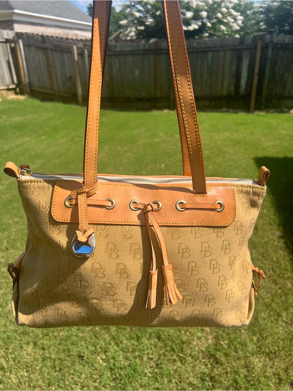 Dooney & Bourke DB Tassel Zip Top Tote Sand Tan Canvas Saddle
Tan Leather - Picture 14 of 14